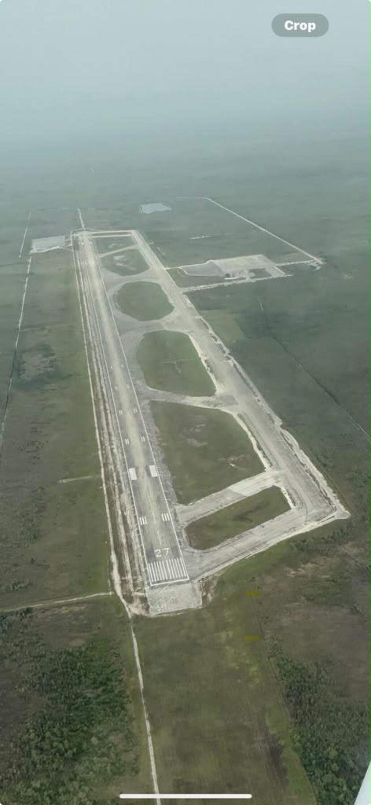 An aerial photo shows all the white industrial tents that once transformed the Dade-Collier Training and Transitional Airport into the immigration detention center Alligator Alcatraz have been taken down.